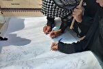 توقيع عريضة لإدانة الكيان الصهيوني في مسيرة الأربعين الحسیني + صور