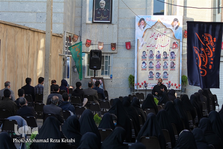 عکس | برگزاری مراسم آبروی محله در کوچه‌ای با 8 شهید